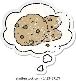 cartoon cookies with thought bubble as a distressed worn sticker