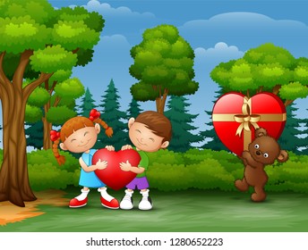 Cartoon couple kid holding heart with teddy bear