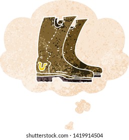 cartoon cowboy boots with thought bubble in grunge distressed retro textured style