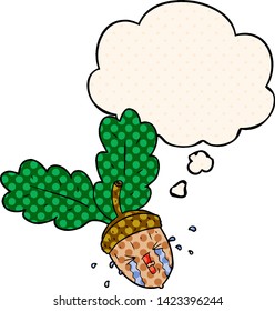 cartoon crying acorn with thought bubble in comic book style