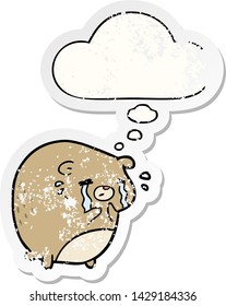 cartoon crying bear with thought bubble as a distressed worn sticker