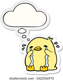 cartoon crying bird with thought bubble as a printed sticker