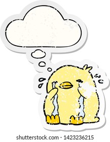 cartoon crying bird with thought bubble as a distressed worn sticker
