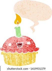 cartoon cupcake with candle with speech bubble in grunge distressed retro textured style
