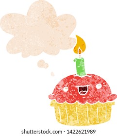 cartoon cupcake with candle with thought bubble in grunge distressed retro textured style