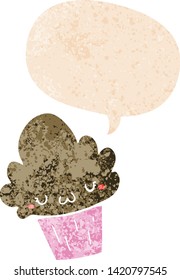 cartoon cupcake with face with speech bubble in grunge distressed retro textured style
