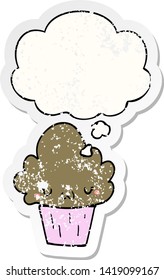 cartoon cupcake with face with thought bubble as a distressed worn sticker