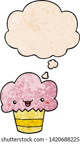 cartoon cupcake with face with thought bubble in grunge texture style