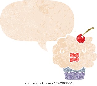 cartoon cupcake with speech bubble in grunge distressed retro textured style