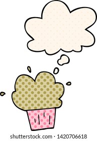 cartoon cupcake with thought bubble in comic book style