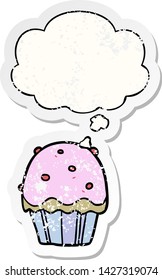 cartoon cupcake with thought bubble as a distressed worn sticker