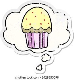 cartoon cupcake with thought bubble as a distressed worn sticker