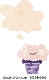 cartoon cupcake with thought bubble in grunge distressed retro textured style