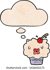 cartoon cupcake with thought bubble in grunge texture style