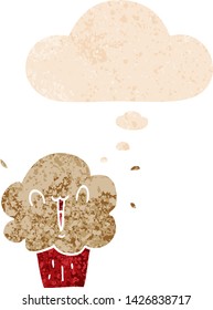 cartoon cupcake with thought bubble in grunge distressed retro textured style