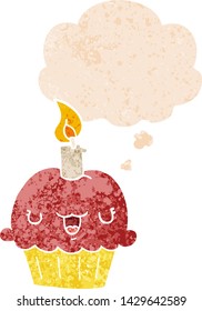 cartoon cupcake with thought bubble in grunge distressed retro textured style