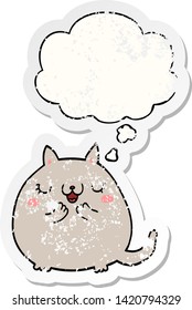 cartoon cute cat with thought bubble as a distressed worn sticker