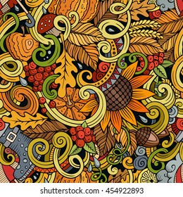 Cartoon cute doodles hand drawn autumn seamless pattern. Colorful detailed, with lots of objects background. Endless funny vector illustration. Color backdrop with fall season symbols and items