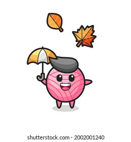 cartoon of the cute yarn ball holding an umbrella in autumn , cute style design for t shirt, sticker, logo element