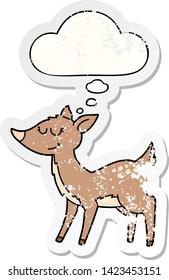 cartoon deer with thought bubble as a distressed worn sticker