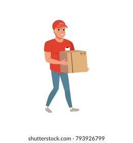 Cartoon delivery man carrying cardboard box. Smiling courier character in working uniform red t-shirt, cap and blue jeans. Post office worker. Flat vector design