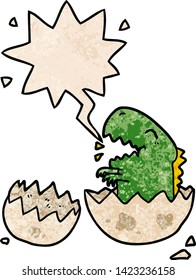 cartoon dinosaur hatching from egg with speech bubble in retro texture style