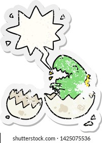 cartoon dinosaur hatching from egg with speech bubble distressed distressed old sticker
