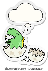 cartoon dinosaur hatching with thought bubble as a printed sticker