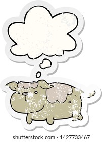 cartoon dog with thought bubble as a distressed worn sticker