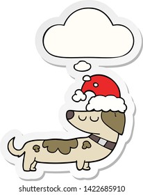 cartoon dog wearing christmas hat with thought bubble as a printed sticker