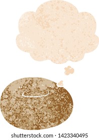 cartoon donut with thought bubble in grunge distressed retro textured style