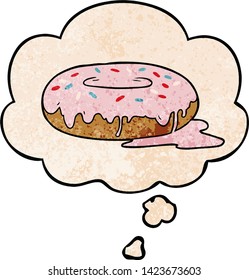 cartoon donut with thought bubble in grunge texture style