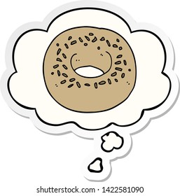 cartoon donut with thought bubble as a printed sticker