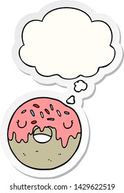 cartoon donut with thought bubble as a printed sticker