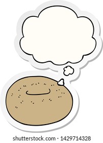 cartoon donut with thought bubble as a printed sticker
