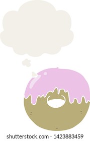 cartoon donut with thought bubble in retro style