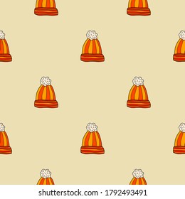 Cartoon doodle wool hat with pompom seamless pattern. Polka dot winter cloth background. Wrapping paper. Vector illustration.  