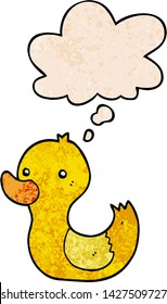 cartoon duck with thought bubble in grunge texture style
