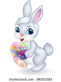 Cartoon Easter bunny holding Easter eggs