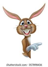 Cartoon Easter bunny rabbit pointing at a background