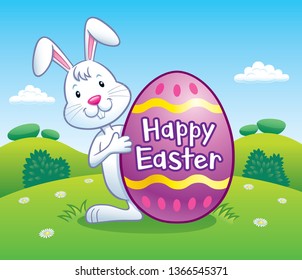 Cartoon of an Easter bunny standing behind a large decorated Easter egg on a small hillside with the words Happy Easter on it.
