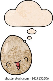 cartoon egg with thought bubble in grunge texture style
