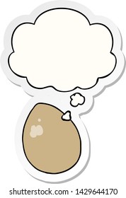 cartoon egg with thought bubble as a printed sticker