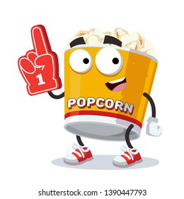 cartoon filled yellow popcorn bucket character mascot with the number 1 one sports fan hand glove on a white background