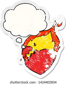 cartoon flaming heart with thought bubble as a distressed worn sticker
