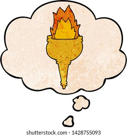 cartoon flaming torch with thought bubble in grunge texture style