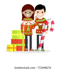 Cartoon flat illustration - New year's holidays. Two people - a guy and girl in warm winter Christmas sweater with the reindeer pattern. The pile of gifts in boxes and a huge sweet lolly pop.