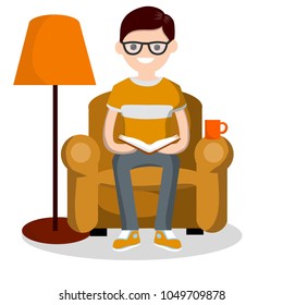 Cartoon flat illustration - a young smart guy in a t-shirt reads a book in a soft chair. room with furniture and a lamp for lighting. interesting leisure and recreation. the education at home.
