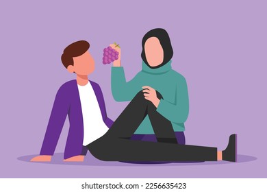 Cartoon flat style drawing romantic couple having picnic in summer park. Relaxing together sitting on ground. Arabian woman feeding grapes fruit to man at outdoor. Graphic design vector illustration