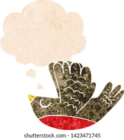 cartoon flying bird with thought bubble in grunge distressed retro textured style